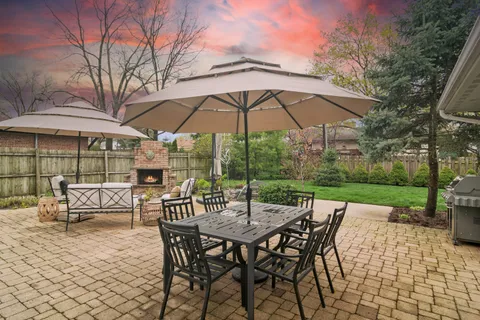 an outdoor space with patio and white umbrellas