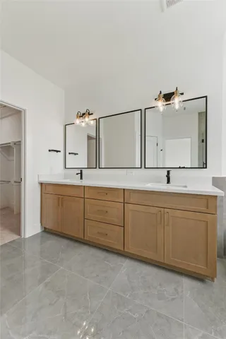 a bathroom with a bathtub and a sink