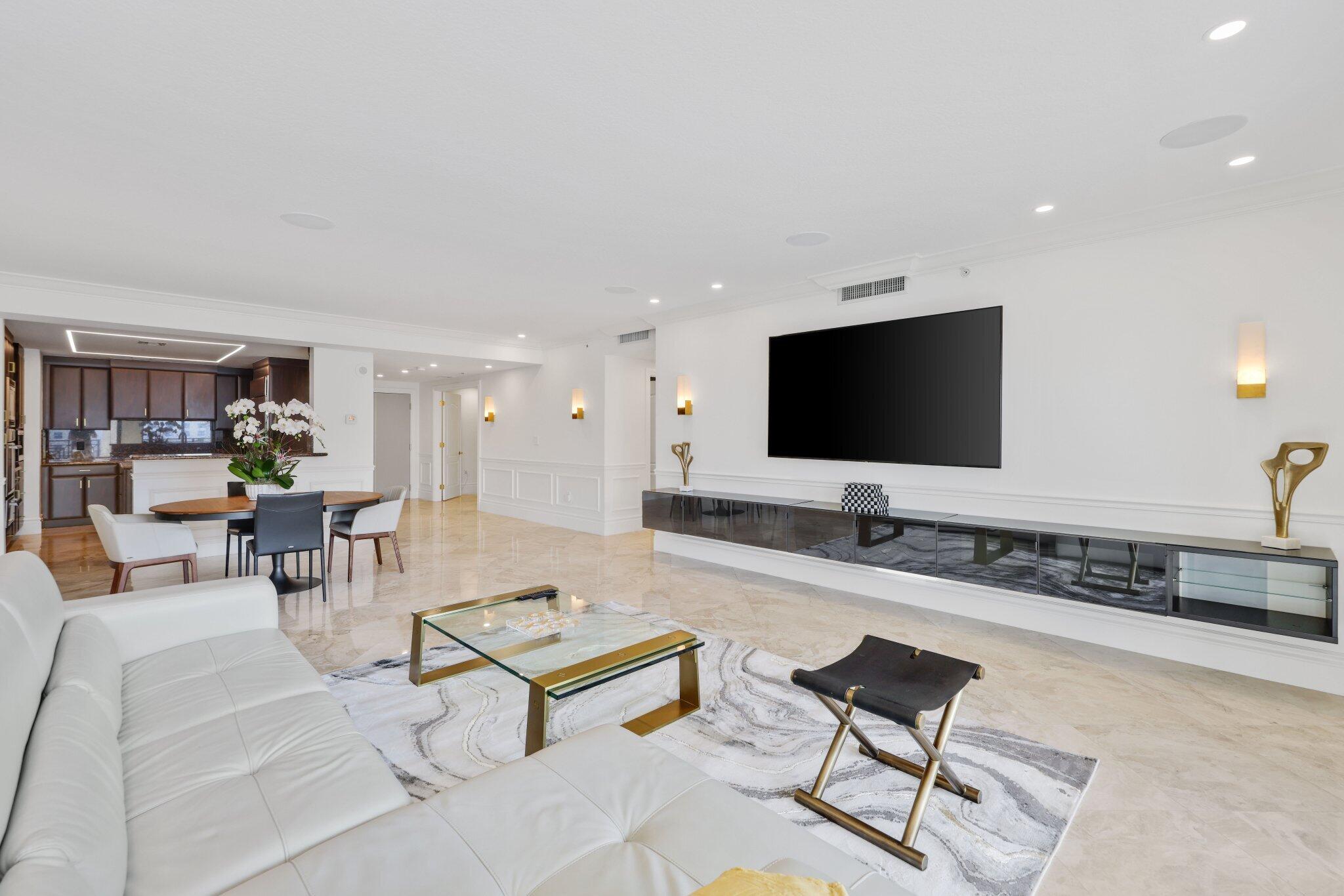200 East Palmetto Park Road, Unit 811 Boca Raton, FL 33432 - Photo 14 of 44 a living room with furniture and a flat screen tv