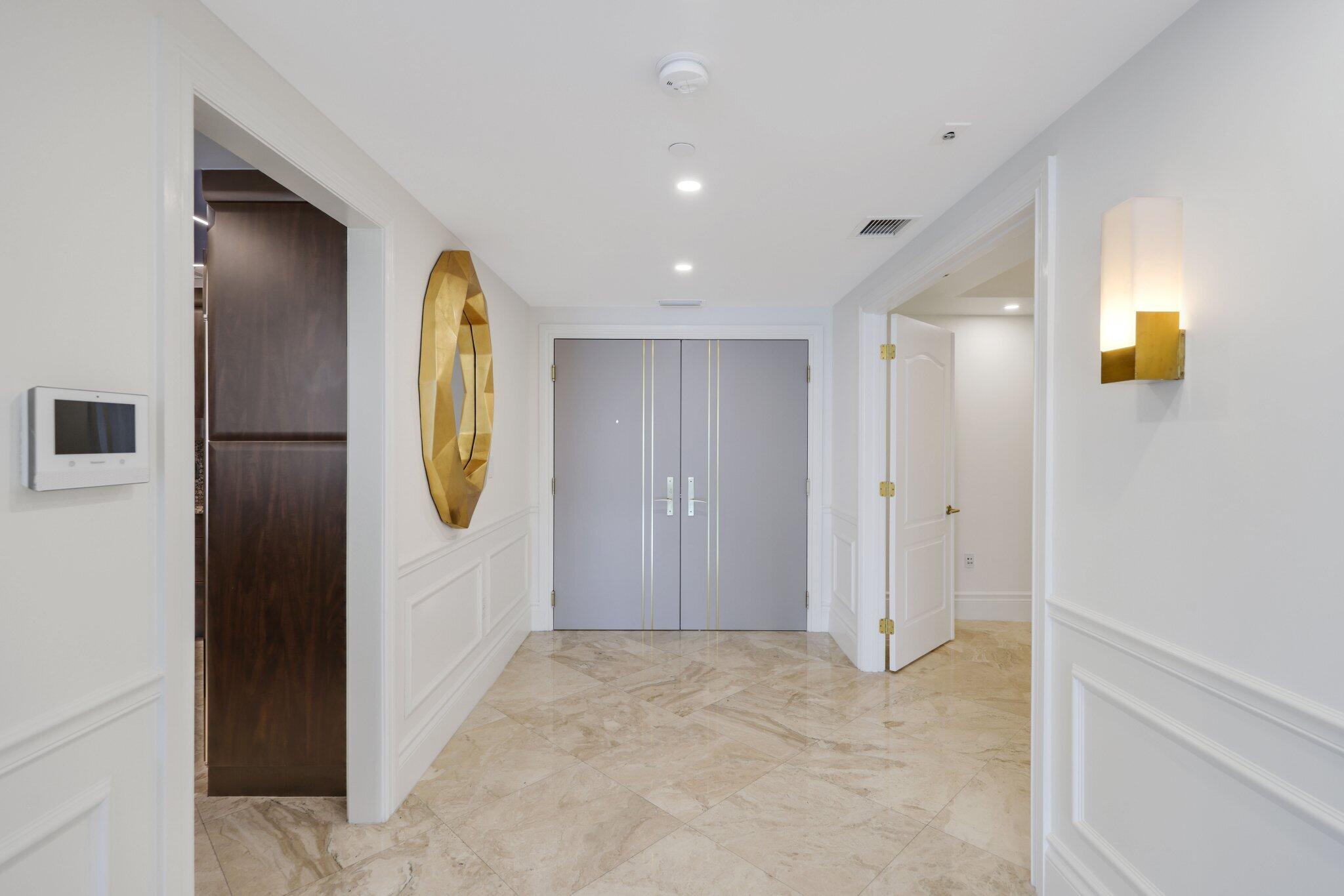 200 East Palmetto Park Road, Unit 811 Boca Raton, FL 33432 - Photo 2 of 44 a view of a hallway with painted walls