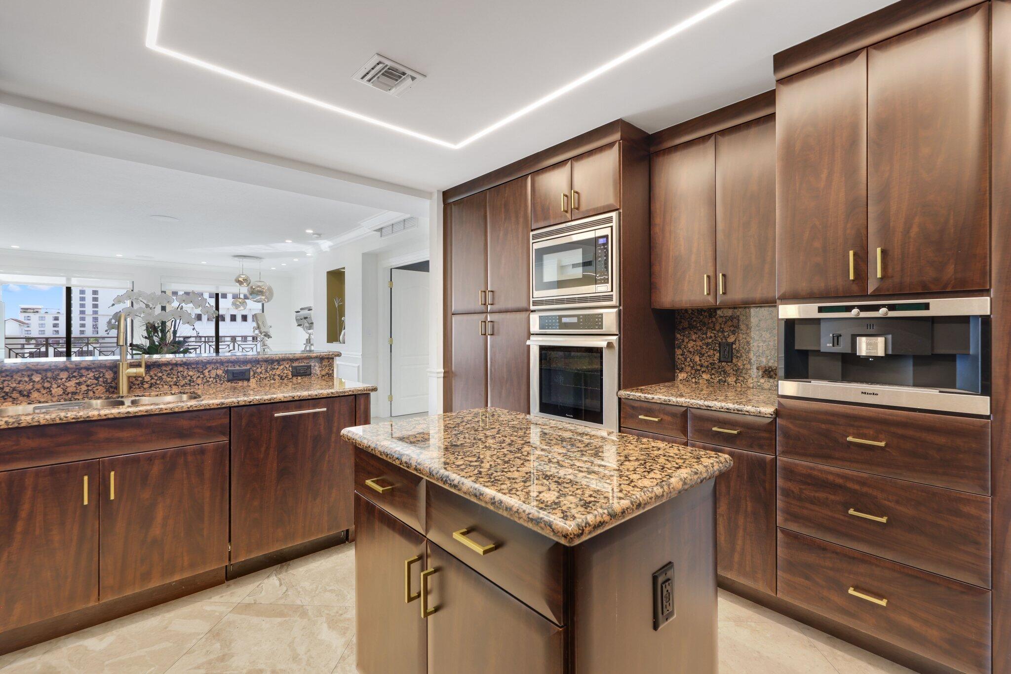 200 East Palmetto Park Road, Unit 811 Boca Raton, FL 33432 - Photo 10 of 44 a kitchen with a sink and cabinets
