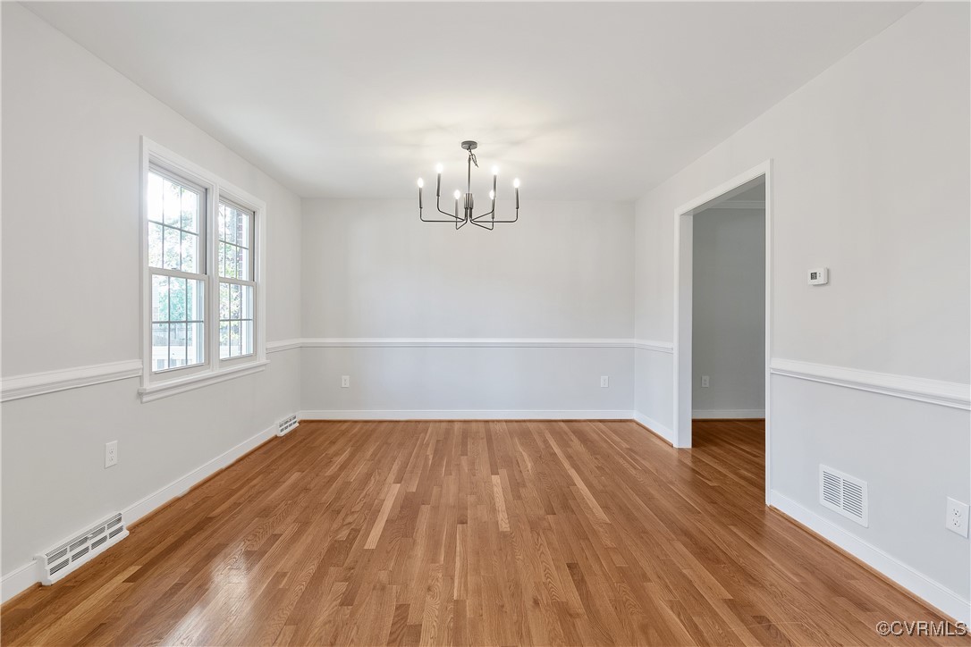 9761 Tuxford Road Chesterfield, VA 23236 - Photo 11 of 49 Spare room featuring wood-type flooring and a chan