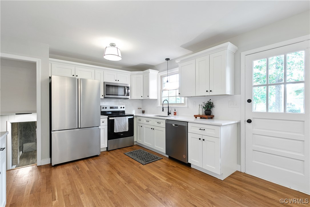 9761 Tuxford Road Chesterfield, VA 23236 - Photo 13 of 49 Kitchen featuring light hardwood / wood-style floo