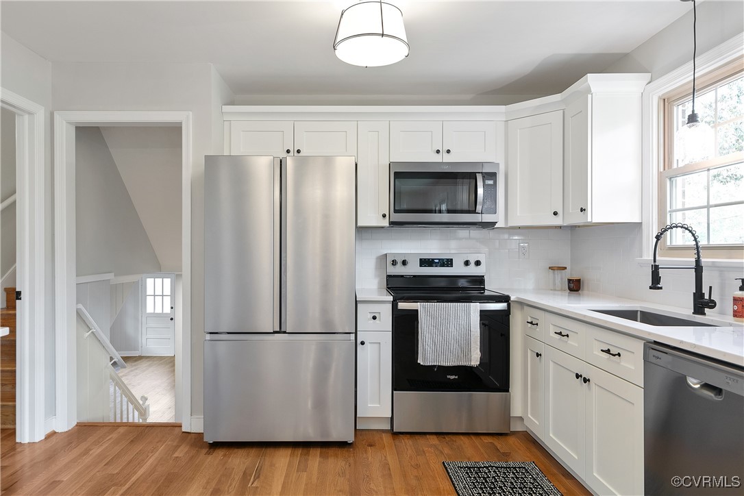 9761 Tuxford Road Chesterfield, VA 23236 - Photo 14 of 49 Kitchen featuring white cabinets, light wood-type