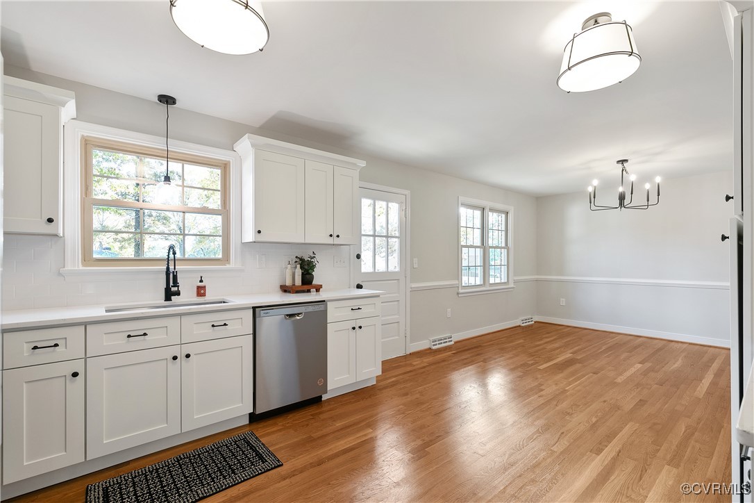 9761 Tuxford Road Chesterfield, VA 23236 - Photo 18 of 49 Kitchen featuring white cabinetry, dishwasher, a h