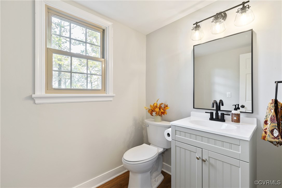 9761 Tuxford Road Chesterfield, VA 23236 - Photo 21 of 49 Bathroom with vanity, hardwood / wood-style floori