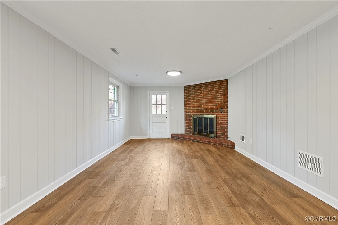 9761 Tuxford Road Chesterfield, VA 23236 - Photo 22 of 49 Unfurnished living room with crown molding, a fire