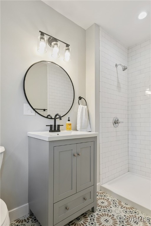 9761 Tuxford Road Chesterfield, VA 23236 - Photo 31 of 49 Bathroom featuring vanity, toilet, a tile shower,