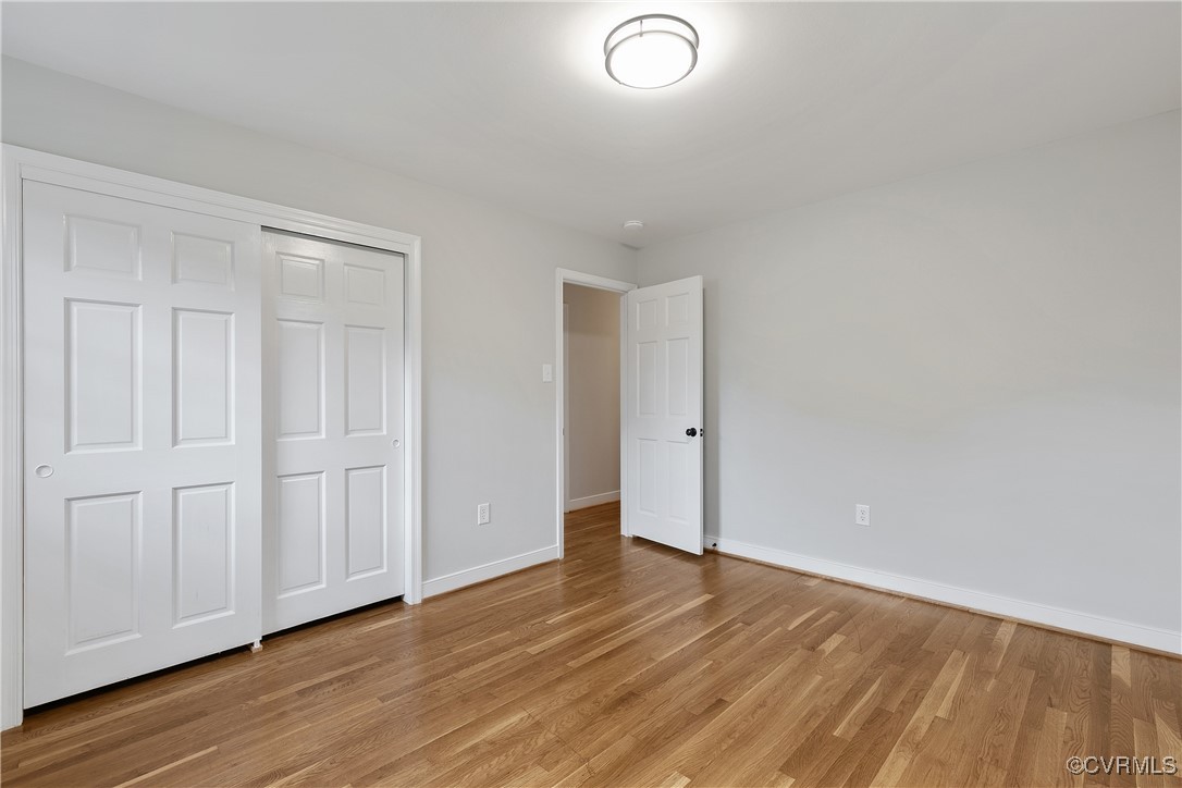 9761 Tuxford Road Chesterfield, VA 23236 - Photo 34 of 49 Unfurnished bedroom with a closet and light hardwo