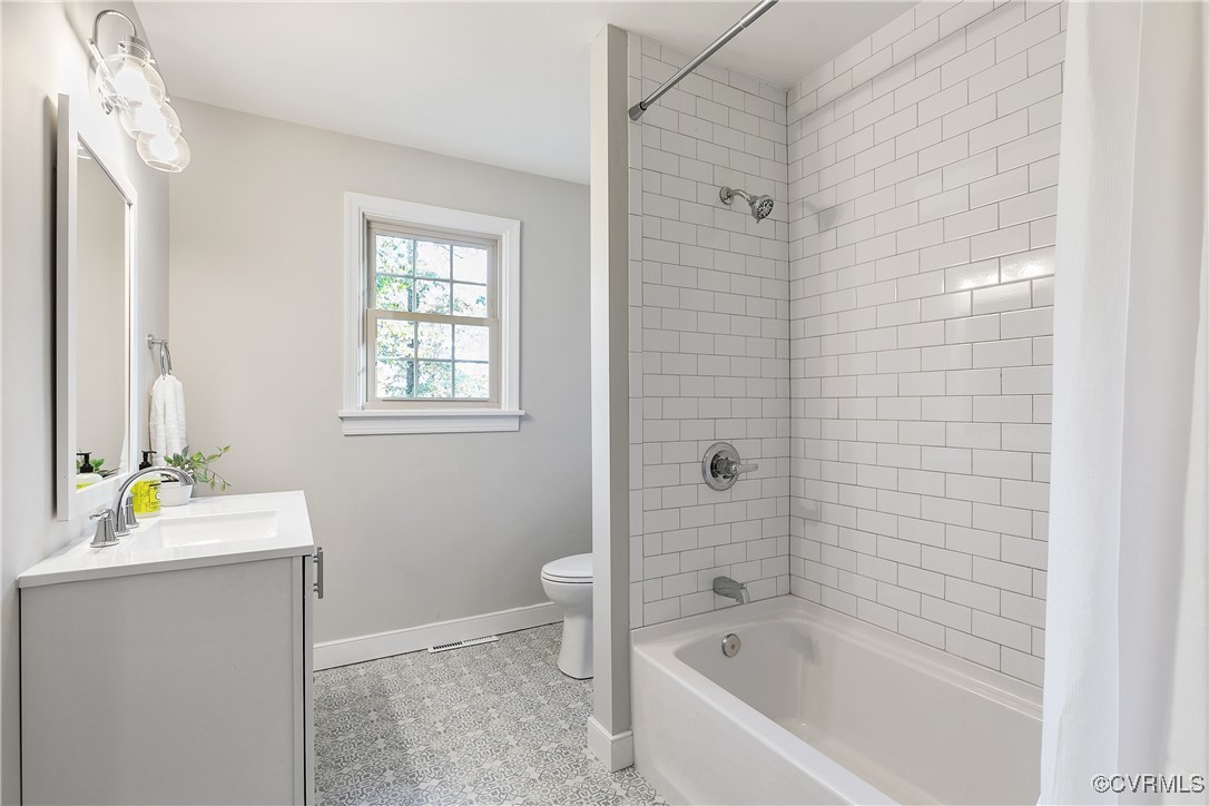 9761 Tuxford Road Chesterfield, VA 23236 - Photo 35 of 49 Full bathroom with vanity, tiled shower / bath com