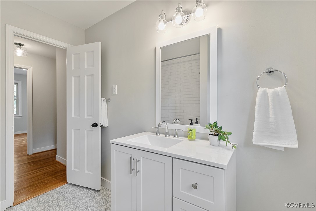 9761 Tuxford Road Chesterfield, VA 23236 - Photo 36 of 49 Bathroom featuring vanity and hardwood / wood-styl