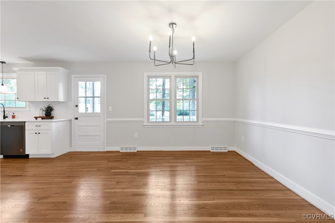 9761 Tuxford Road Chesterfield, VA 23236 - Photo 9 of 49 Unfurnished dining area featuring dark wood-type f