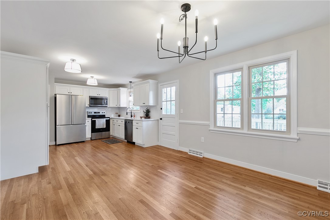 9761 Tuxford Road Chesterfield, VA 23236 - Photo 10 of 49 Kitchen featuring white cabinetry, a healthy amoun