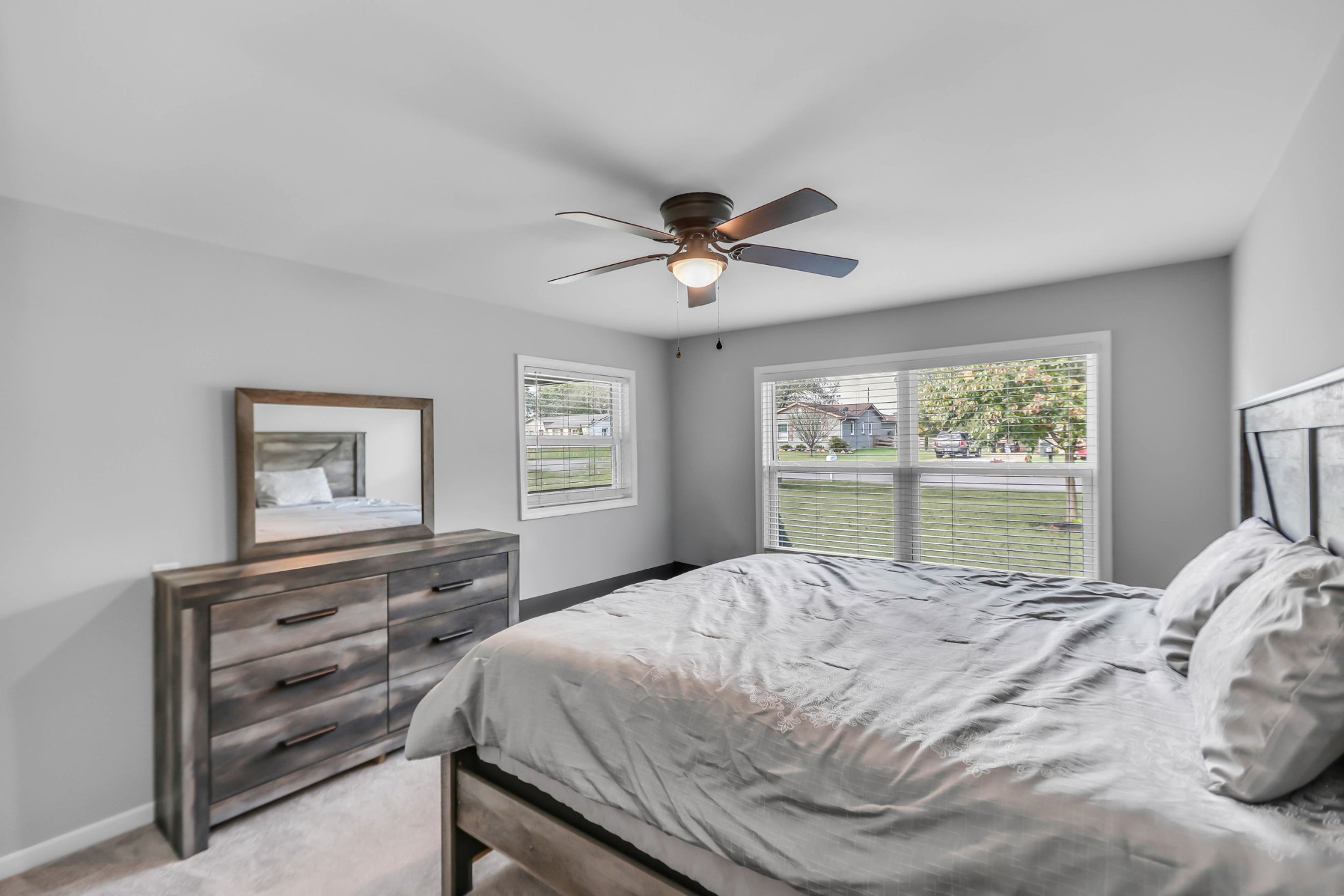 105 Jerry Street Portland, TN 37148 - Photo 13 of 40 a bed sitting in a bedroom next to a window