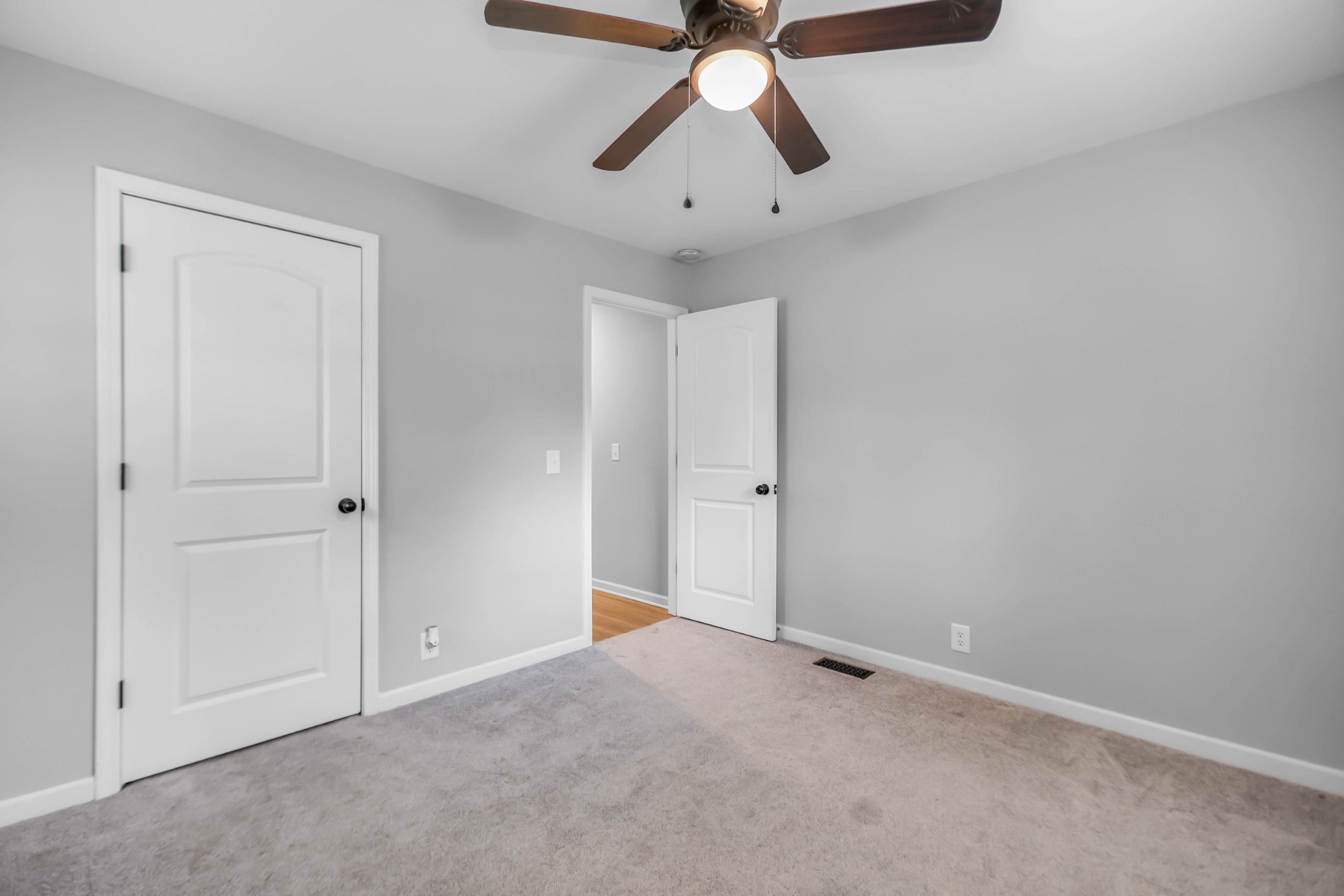 105 Jerry Street Portland, TN 37148 - Photo 20 of 40 an empty room with chandelier fan