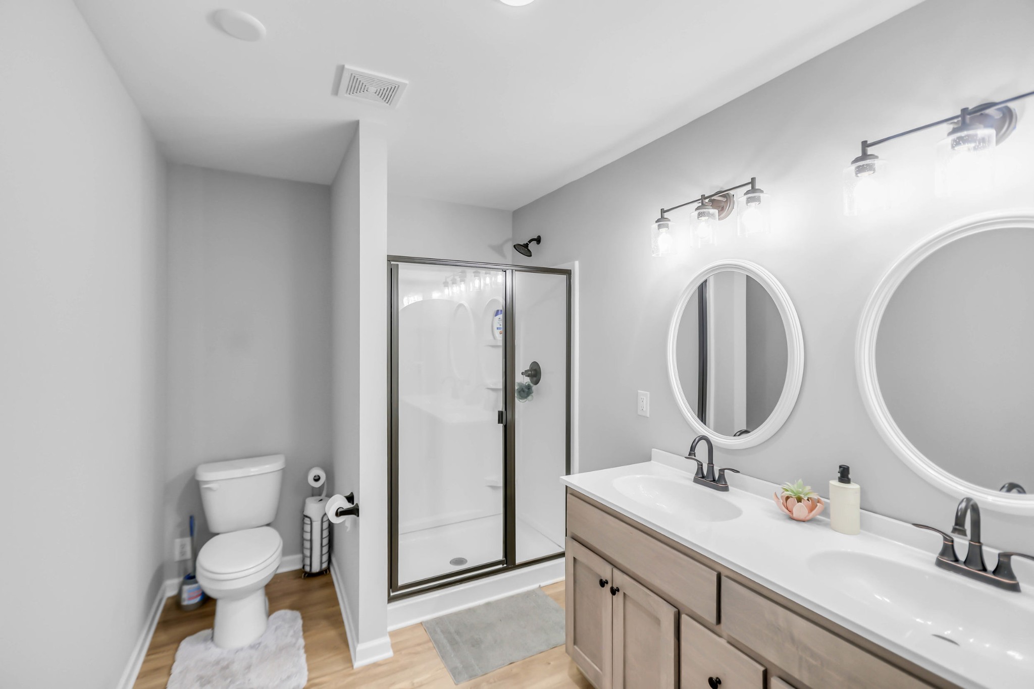 105 Jerry Street Portland, TN 37148 - Photo 23 of 40 a bathroom with a toilet sink and mirror