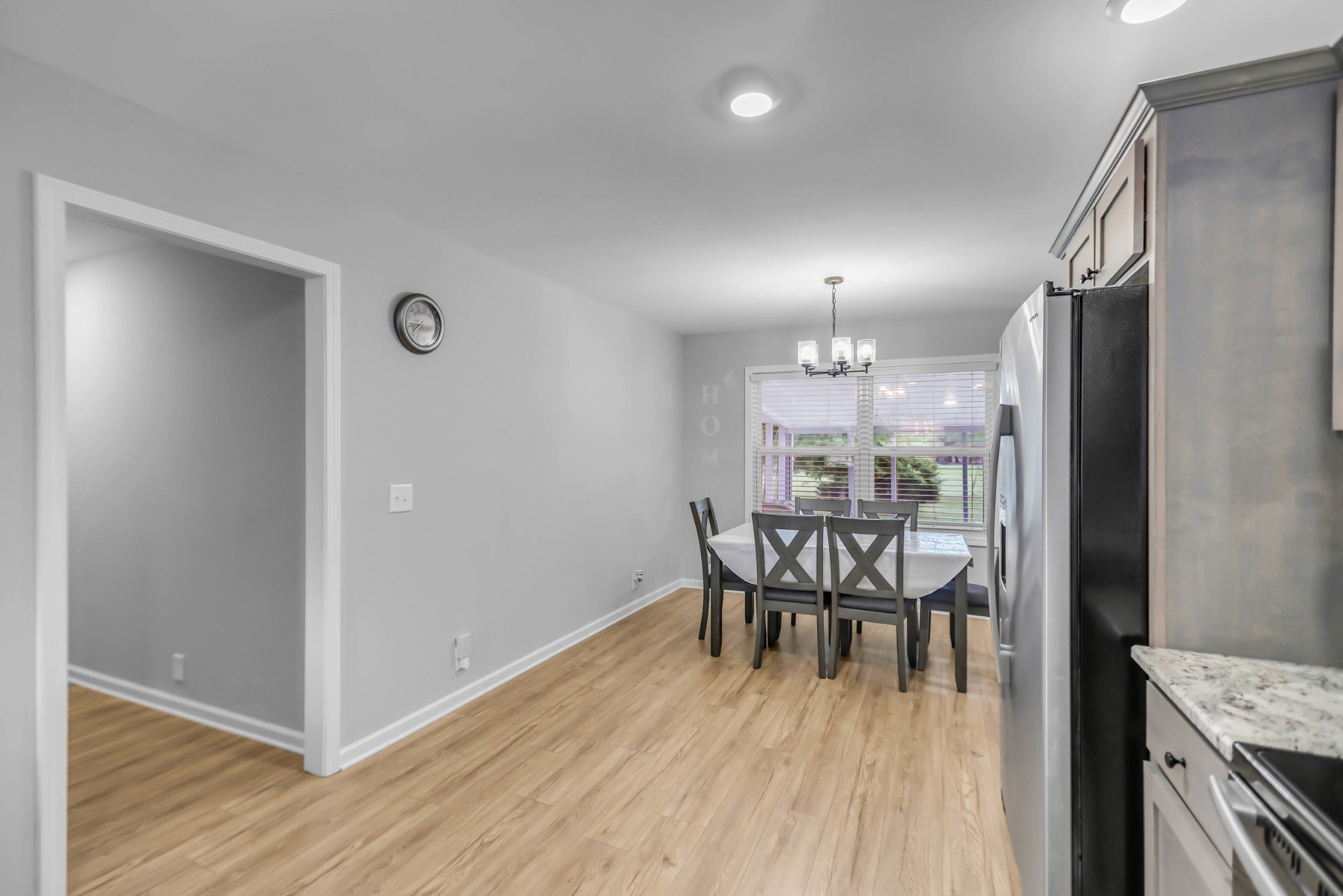 105 Jerry Street Portland, TN 37148 - Photo 10 of 40 a view of a dining room with furniture window and wooden floor