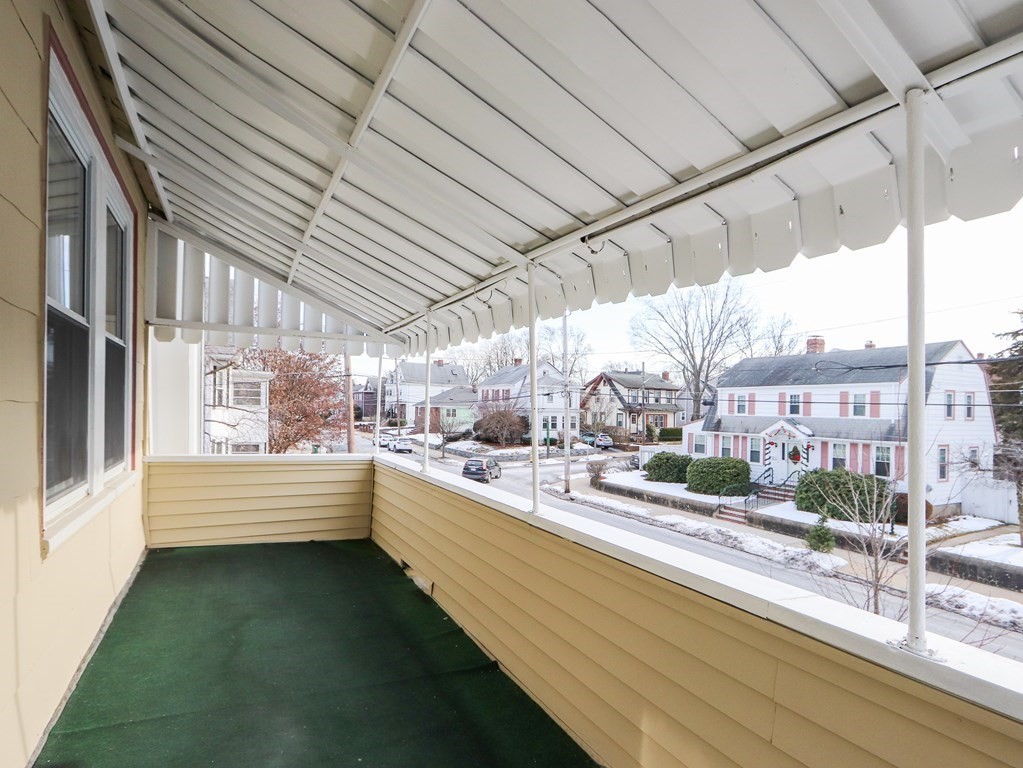 169 George Street Medford, MA 02155 - Photo 15 of 22 a view of a patio with a table and chairs