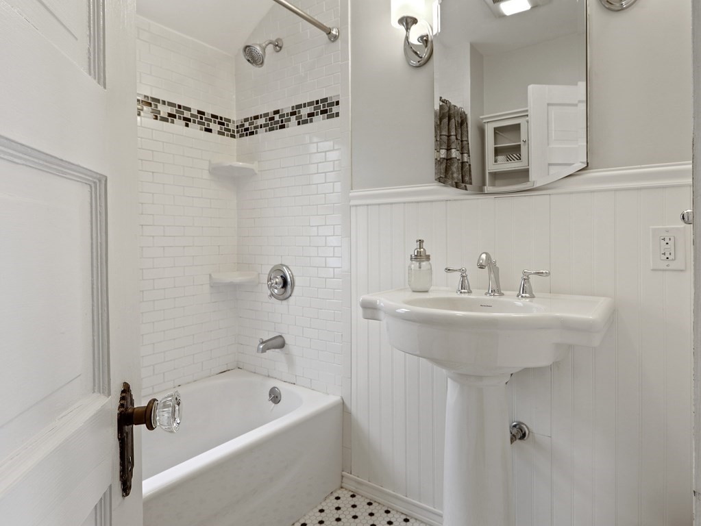 169 George Street Medford, MA 02155 - Photo 9 of 22 a bathroom with a sink a toilet and shower