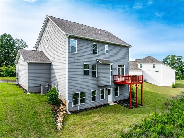 a view of a house with a yard porch and sitting area