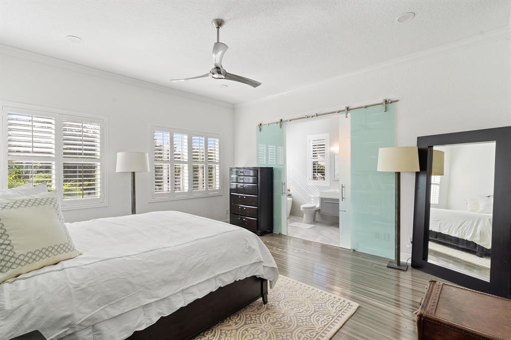 518 Southwest 9th Street, Unit 518 Fort Lauderdale, FL 33315 - Photo 21 of 29 a spacious bedroom with a bed and wooden floor