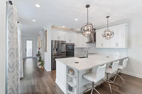 a kitchen with a table and chairs in it