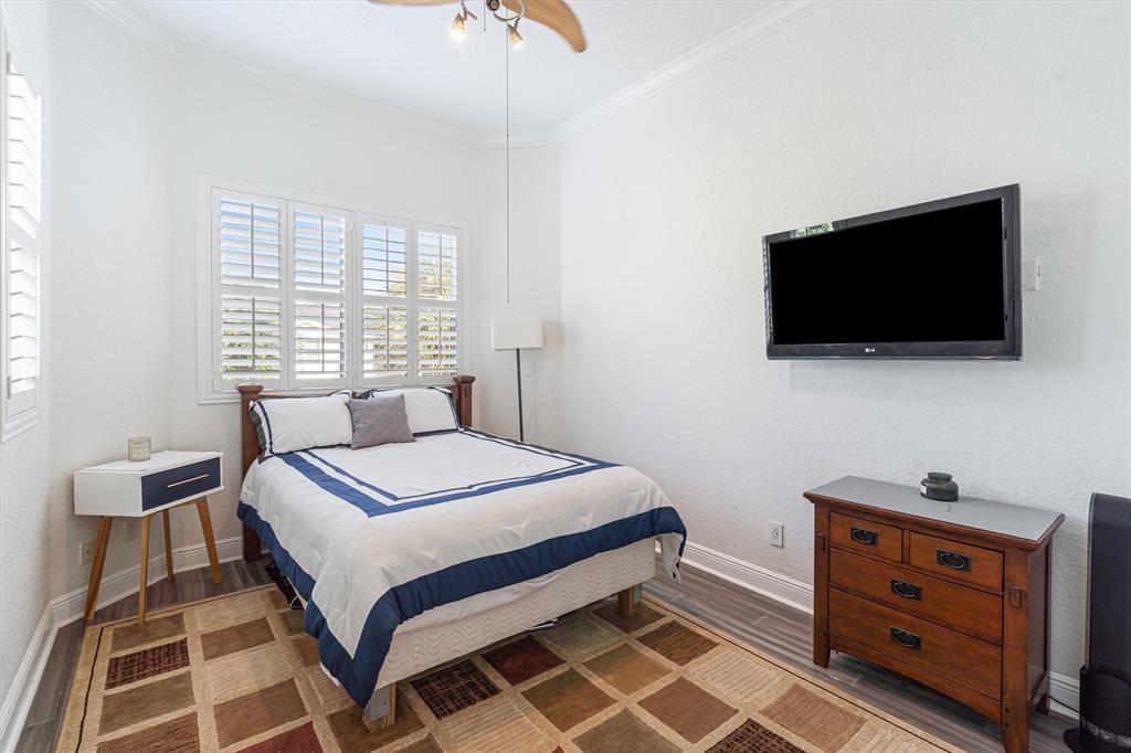 518 Southwest 9th Street, Unit 518 Fort Lauderdale, FL 33315 - Photo 8 of 29 a bedroom with a bed and a flat screen tv