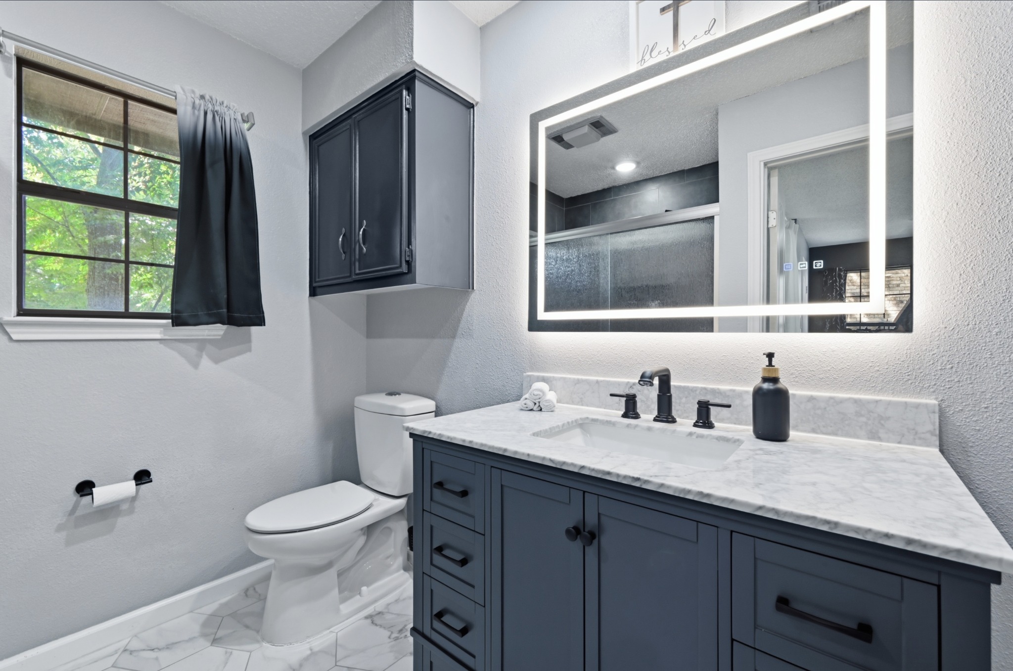 303 Pin Oak Drive Georgetown, TX 78628 - Photo 22 of 36 a bathroom with a granite countertop sink a toilet and mirror
