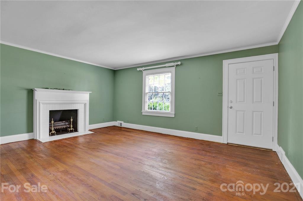 110 West Ridge Road Salisbury, NC 28147 - Photo 2 of 41 an empty room with windows and fireplace