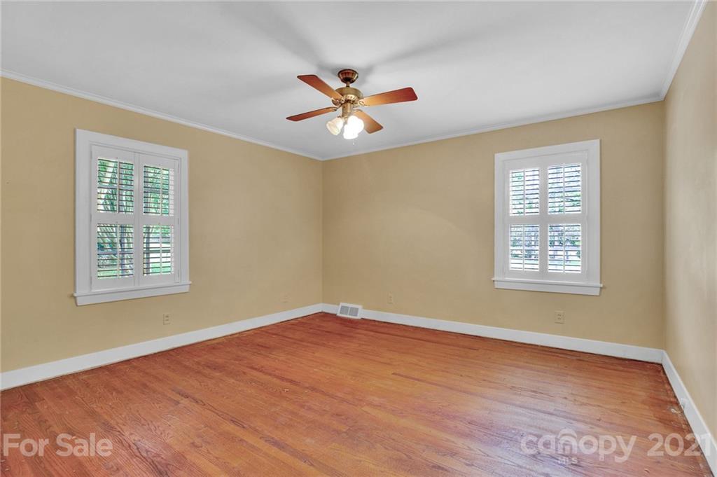 110 West Ridge Road Salisbury, NC 28147 - Photo 21 of 41 a view of an empty room with a window and wooden floor