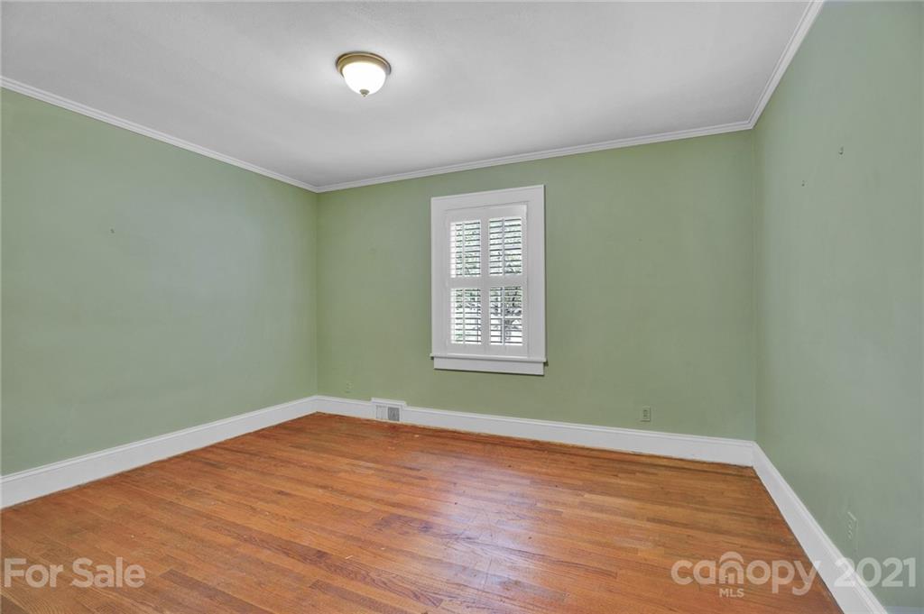 110 West Ridge Road Salisbury, NC 28147 - Photo 22 of 41 an empty room with wooden floor and windows