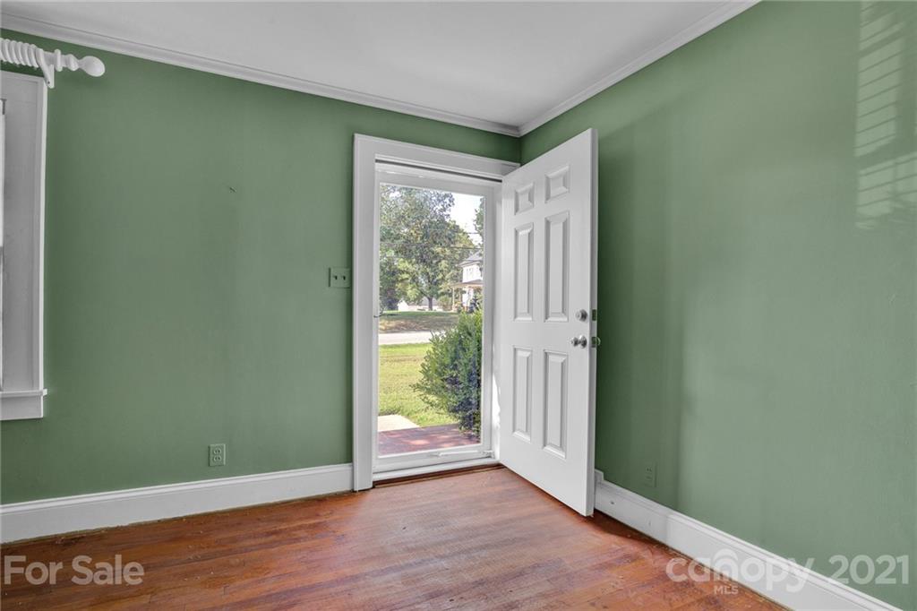110 West Ridge Road Salisbury, NC 28147 - Photo 28 of 41 a view of an empty room with wooden floor and a window