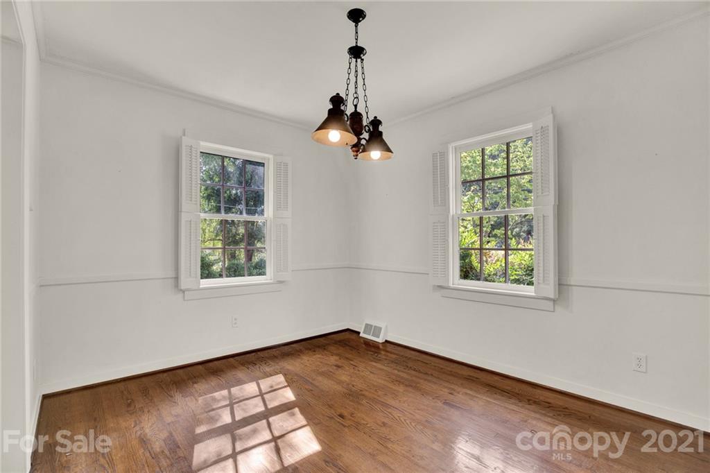 110 West Ridge Road Salisbury, NC 28147 - Photo 30 of 41 an empty room with wooden floor cabinet and windows