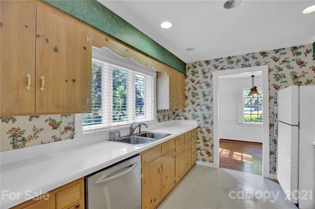 110 West Ridge Road Salisbury, NC 28147 - Photo 33 of 41 a kitchen with a sink and a refrigerator