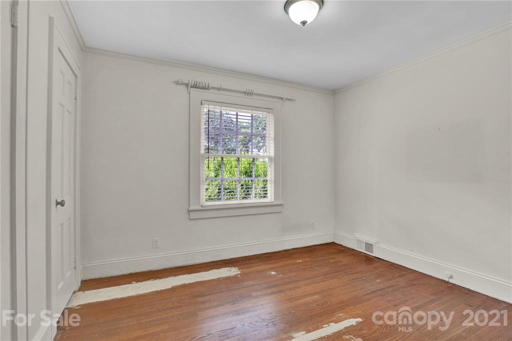 110 West Ridge Road Salisbury, NC 28147 - Photo 34 of 41 an empty room with wooden floor and windows