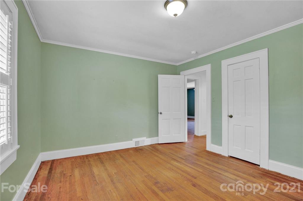 110 West Ridge Road Salisbury, NC 28147 - Photo 36 of 41 a view of an empty room with wooden floor and a window