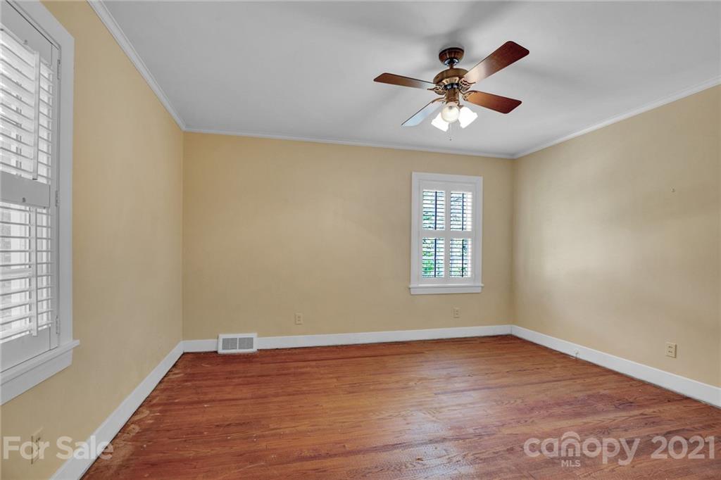 110 West Ridge Road Salisbury, NC 28147 - Photo 39 of 41 a view of an empty room with wooden floor and a window