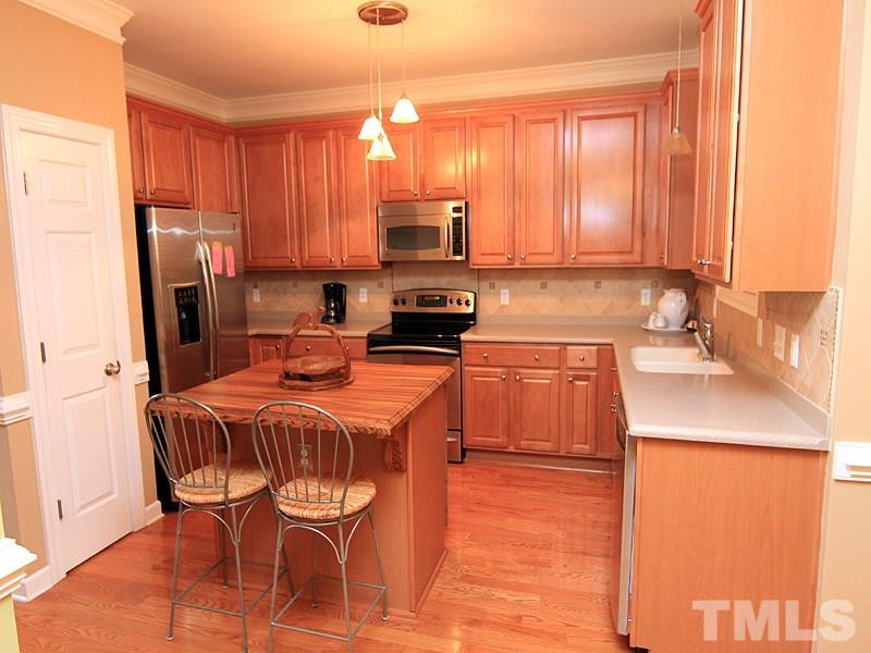 3524 Edgemont Drive Raleigh, NC 27612 - Photo 4 of 17 Lots of cabinet space with an island.
