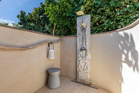 a bedroom with a large bed and a large window