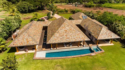 a view of a swimming pool with a yard