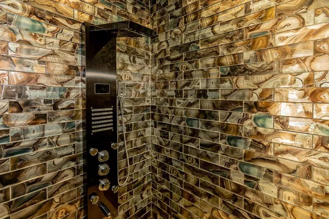 a bathroom with a toilet and shower