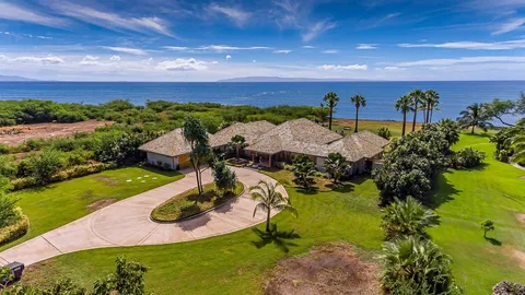 a view of a patio with a dining table and chairs