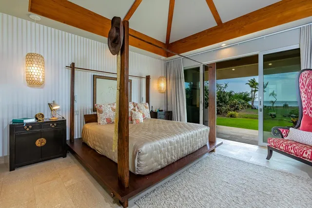 a view of living room with furniture and a potted plant