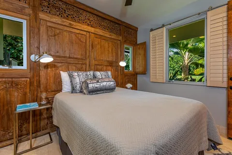 a aerial view of a house with swimming pool garden view and lake view