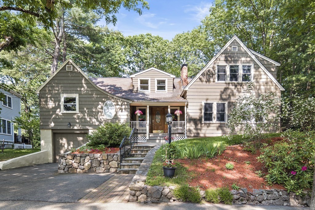 a front view of a house with garden