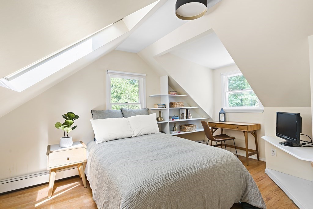26 Leland Road Brookline, MA 02467 - Photo 13 of 30 a bedroom with a bed and a flat screen tv