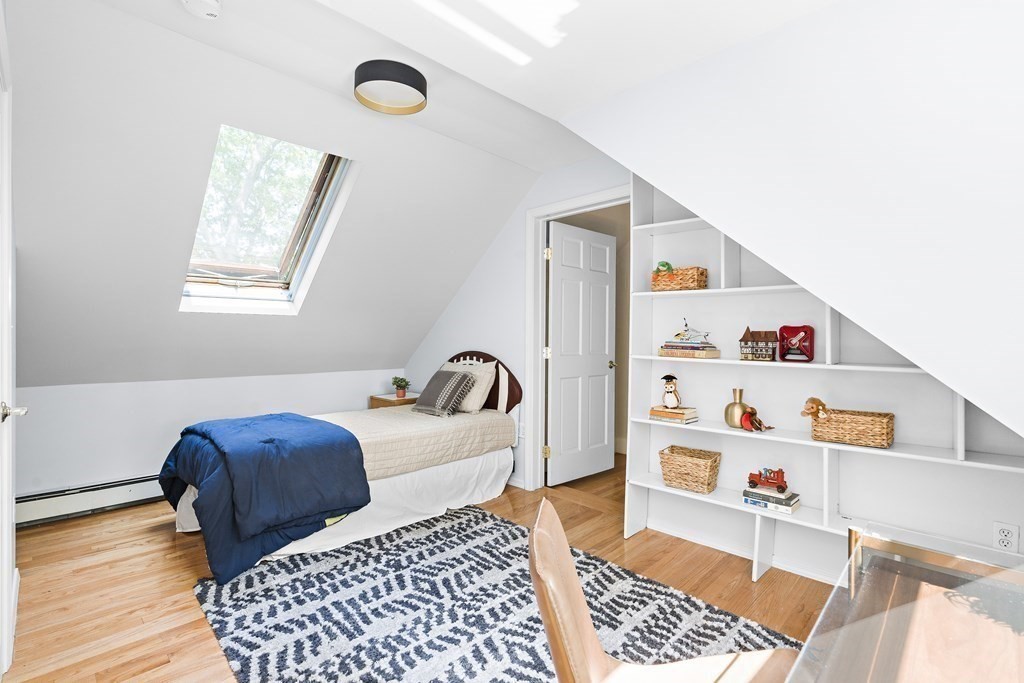 26 Leland Road Brookline, MA 02467 - Photo 14 of 30 a bedroom with furniture and a window