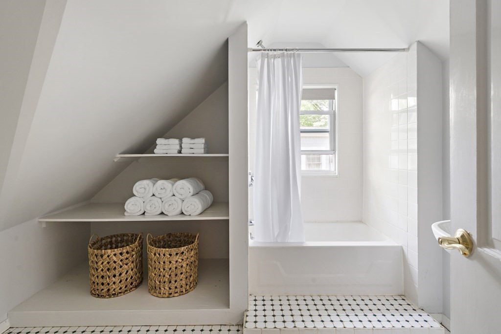 26 Leland Road Brookline, MA 02467 - Photo 16 of 30 a bathroom with a bathtub and shower