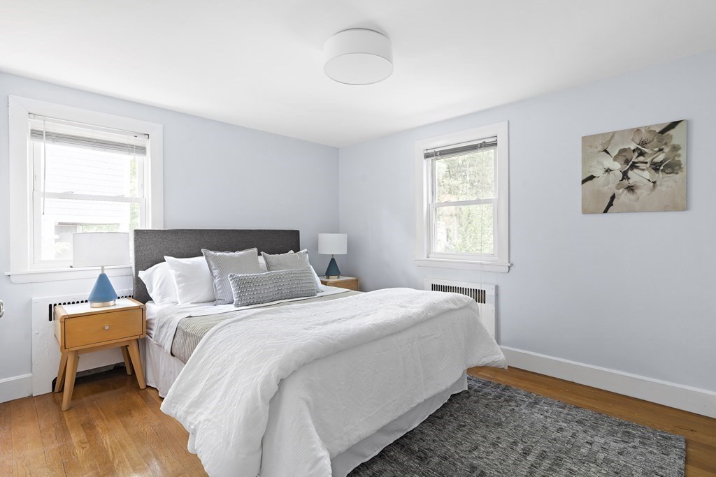 26 Leland Road Brookline, MA 02467 - Photo 18 of 30 a bedroom with a bed and wooden floor