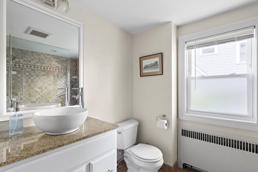 26 Leland Road Brookline, MA 02467 - Photo 20 of 30 a white bath tub sitting next to a white toilet